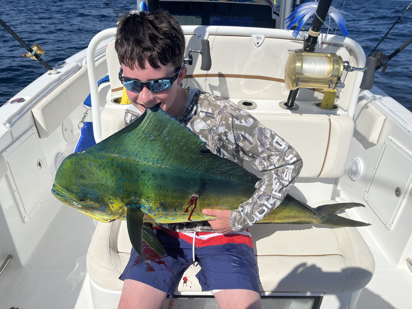 Young angler with a big mahi mahi