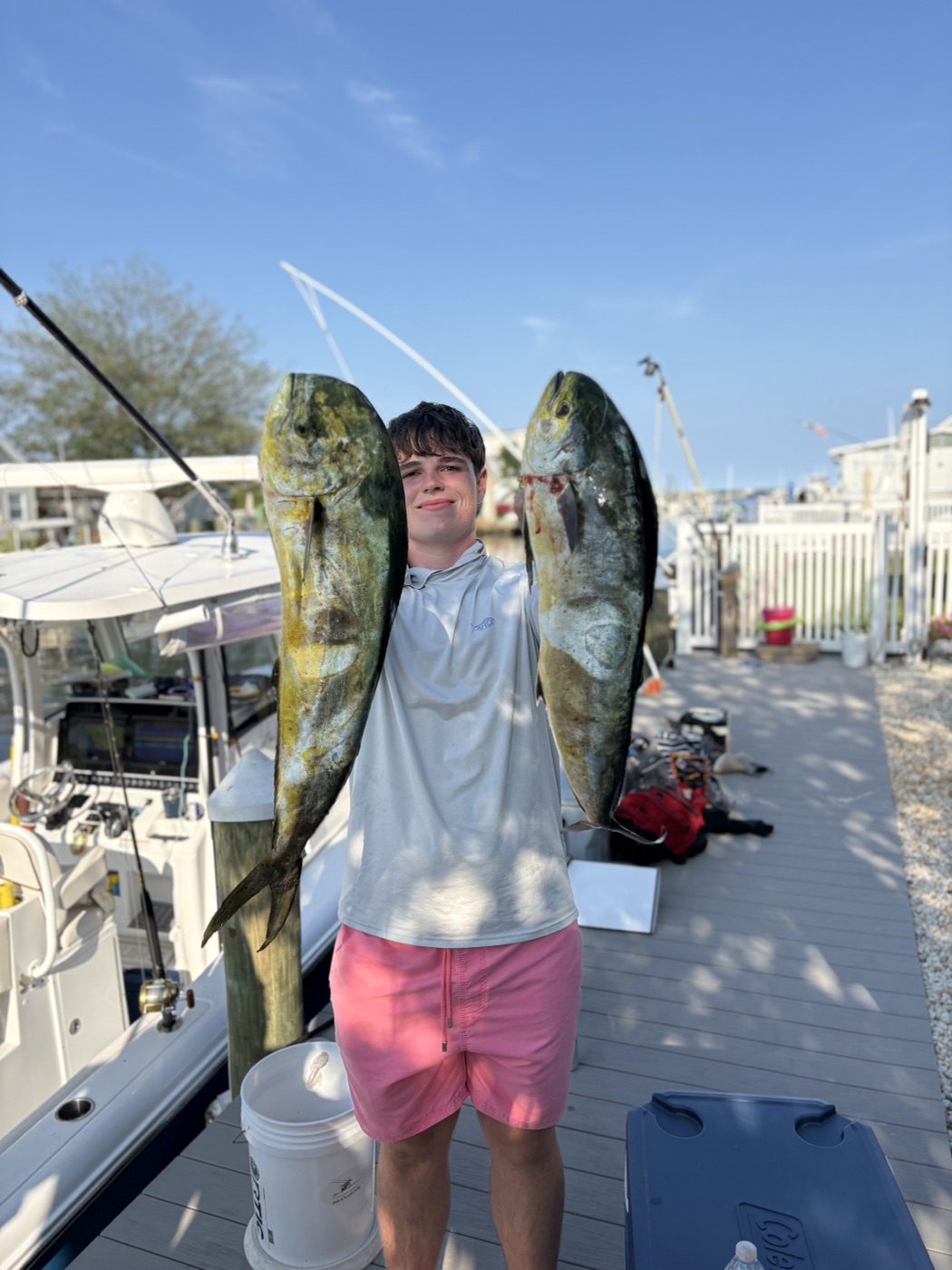 Young angler with two mahi mahi
